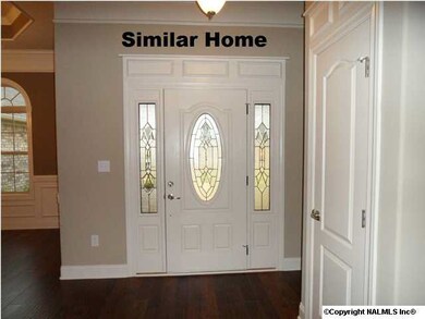 Front door with side lights.