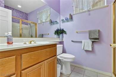bathroom 1, single sink, tile floor and enclosed shower