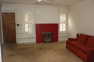 Living area.  Nice shelves for displaying collecti