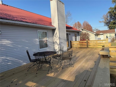 Wooden deck featuring outdoor dining area