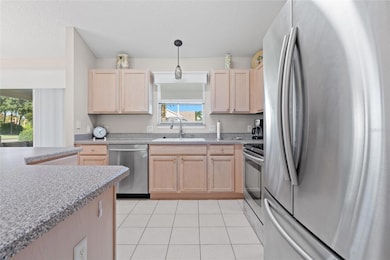 Ceramic Tile throughout the main area.  Upgraded Appliances in Kitchen and Laundry room.