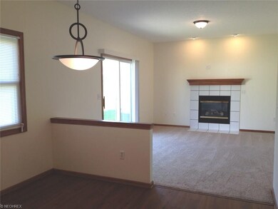 Family room with fireplace and sliding doors to ba