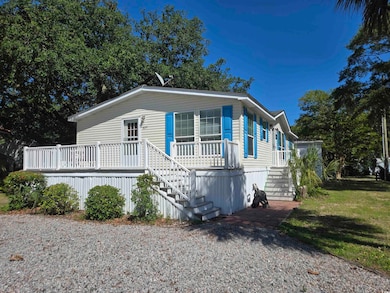 Manufactured / mobile home featuring stairs