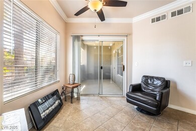Living area featuring visible vents, ornamental mo