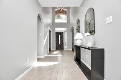 Step into elegance with a grand two-story foyer, c
