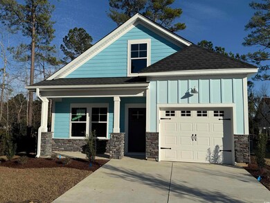 View of front of house with an attached garage, co