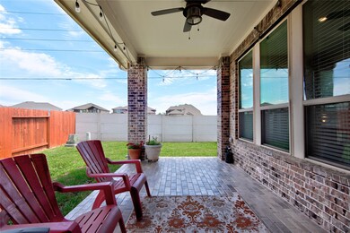 Polished tile pavers provide a nice landing for the backyard patio. The cover offers plenty of afternoon shade. A gas line stub is also conveniently located here so don't forget your grill!