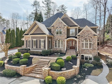 Craftsman-style house featuring stone siding and roof with shingles
