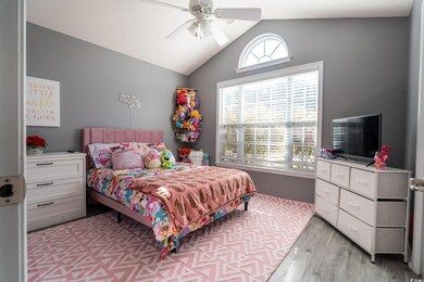 Bedroom featuring light wood-type flooring, a ceil