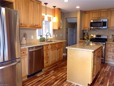 Beautiful kitchen with maple cabinetry, granite co