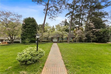 Beautiful mature landscaping with dogwoods and azaleas