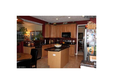 Gorgeous kitchen with granite countertops and stai