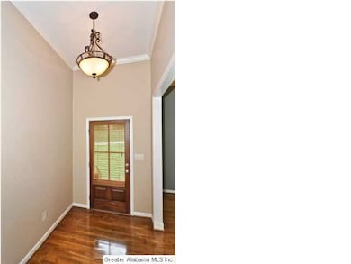 Welcoming entryway with gorgeous hardwood floors a