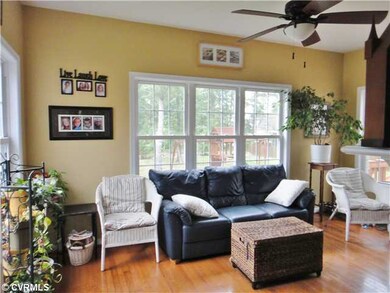 Other - Sunroom with hardwood floors, fireplace an