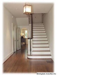 Inviting Front Foyer with Tall Ceilings and Gleami