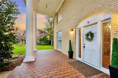 Exterior entry at dusk with a yard