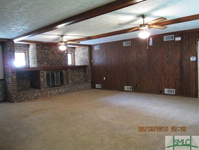Huge family room with wood burning fireplace