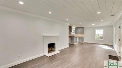 Living room with working fireplace overlooking din