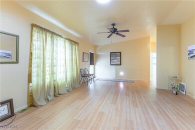 Living room with wood finished floors and a ceilin