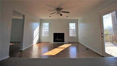 Family Room complete with wood burning fireplace a