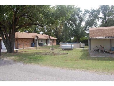 Exterior Front. West side yard