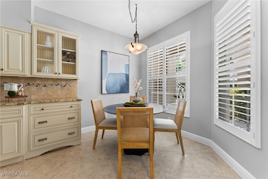 Dining space featuring light tile patterned floors