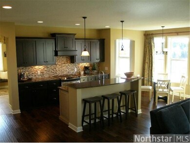 Spacious kitchen open to family room and dinette.
