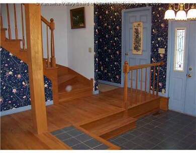 Living Room. Lovely hardwood throughout. Stairway