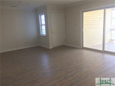 Living room with new laminate flooring.  Great ope