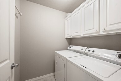 Laundry room with separate washer and dryer, cabin