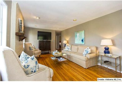 Large living room with hardwood floors & fireplace