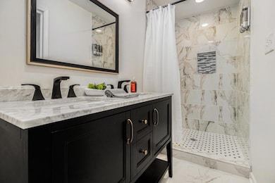 Primary Ensuite With Dual Sinks & A Tiled Shower