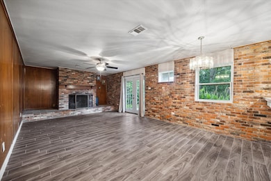 Open living room with fireplace.