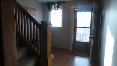 Comfortable entry way and wooden staircase