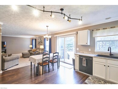 Kitchen with  white cabinets and newer appliances