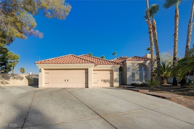 Mediterranean / spanish home featuring an attached garage, concrete driveway, stucco siding, and a tile roof