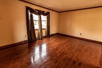 The house has solid wood flooring throughout both 