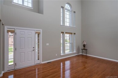 2 story entry and formal living room with gleaming