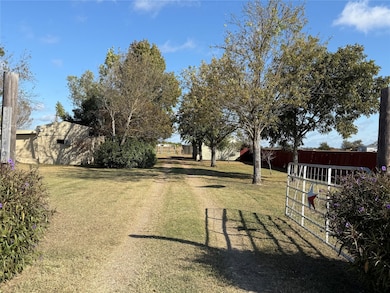 Driveway featuring a gated entry