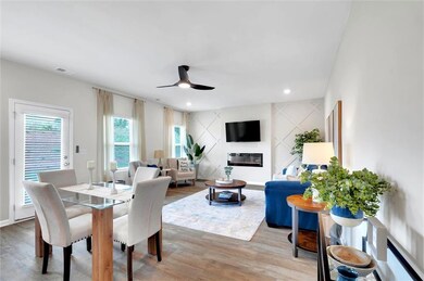Dining space featuring ceiling fan, a glass covere