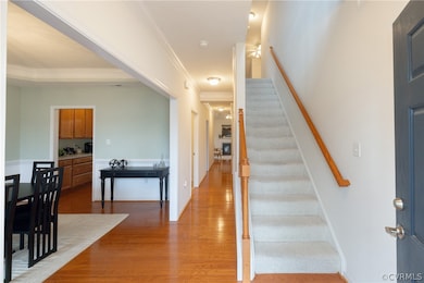 Stairs with wood-type flooring and ornamental mold