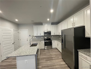 Kitchen with appliances with stainless steel finis
