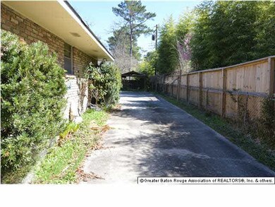 Long driveway to 2 car rear carport and boat stora