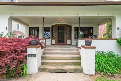 A spacious front porch complete with porch swing - quintessential Lakewood.
