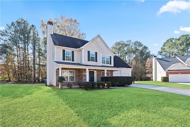 Traditional-style home with a chimney, covered por