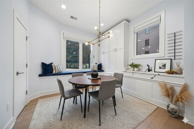 Virtually Staged - Dining room with wet bar and window seat.