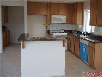 A view of kitchen looking in from dining area
