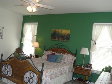 Large master bedroom with hugh bath.  Tall ceiling