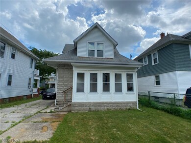 Rear view of property featuring a yard