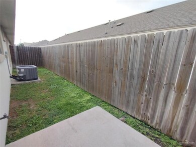 Fenced backyard featuring central AC and a patio